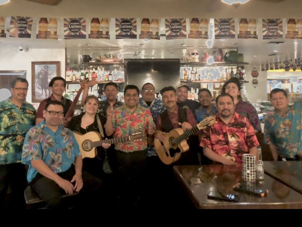 Cisco's Mexican Restaurant: A group of people in hawaiian shirts posing for a photo during Happy Hour.