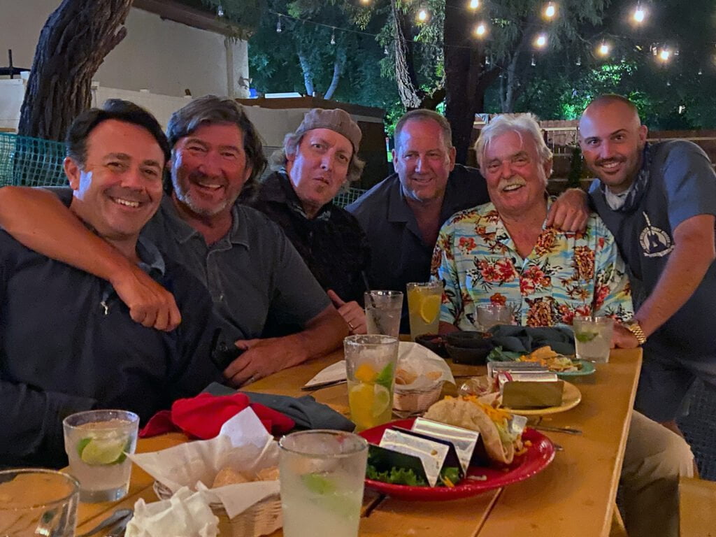 Cisco's Mexican Restaurant: A group of men posing for a photo, celebrating happy hour.