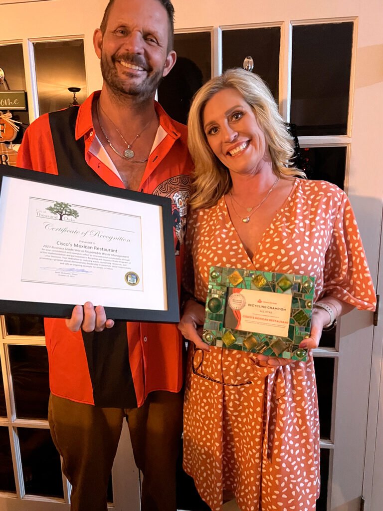 Cisco's Mexican Restaurant: Owners Bobby & Jenell Wilson holding a framed certificate.