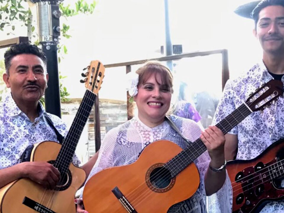 Cisco's Mexican Restaurant: A group of mariachis, smiling and holding guitars.