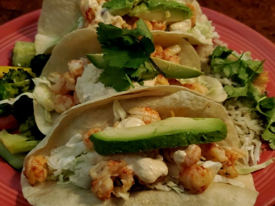 Cisco's Mexican Restaurant: Three shrimp tacos on a red plate, perfect for Mexican food lovers.