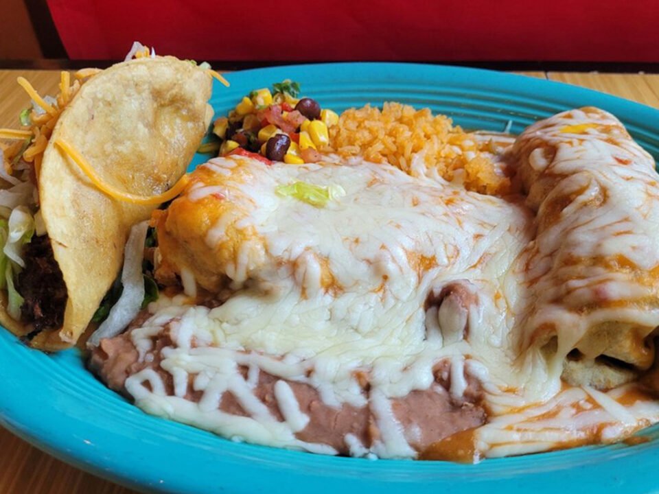 Cisco's Mexican Restaurant: A plate of enchiladas and tacos on a table, perfect for catering or enjoying during happy hour.