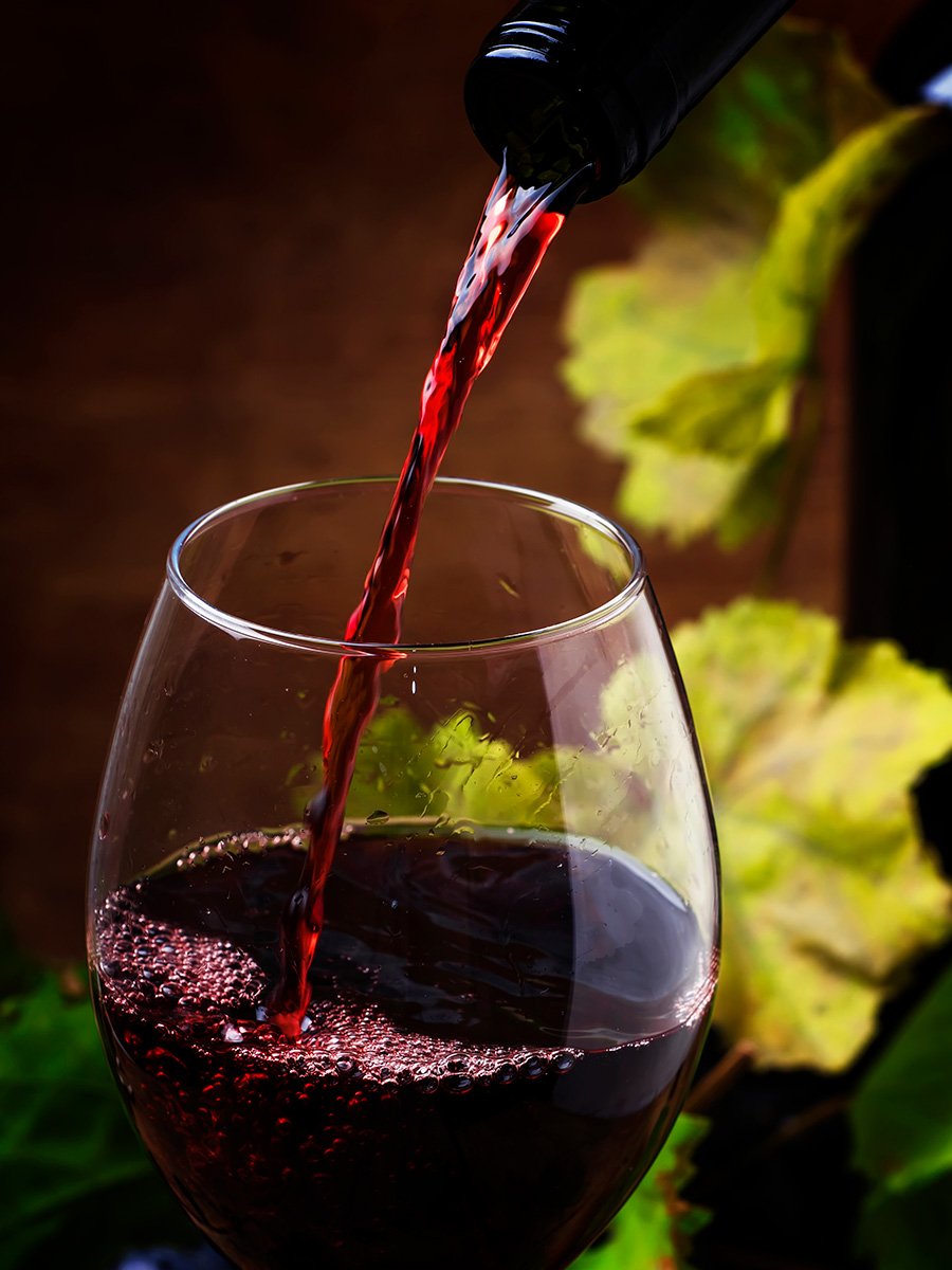 Cisco's Mexican Restaurant: A glass of red wine is being poured into a glass.